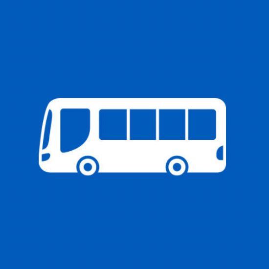 graphic logo of a white bus with 5 windows along the side, on a royal blue background.